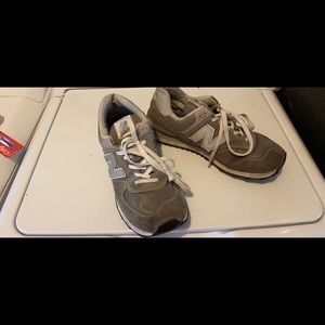 Used men’s New Balance athletic shoe size 11. ML574EGG. Grey suede and leather.